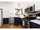 Updated kitchen with modern appliances, white cabinets, and a gas range at 9029 Tumblewood Ave, Las Vegas, NV 89143