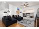 Inviting living room boasting stylish decor, hardwood floors, and a comfy sectional sofa at 9029 Tumblewood Ave, Las Vegas, NV 89143