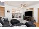 Cozy living room features hardwood floors, a comfortable sectional, and stylish decorative elements at 9029 Tumblewood Ave, Las Vegas, NV 89143