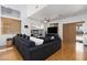 Stylish living room with hardwood floors, a ceiling fan, and a large sectional sofa at 9029 Tumblewood Ave, Las Vegas, NV 89143