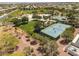 Aerial view of community tennis courts, park, and lush landscaping at 9029 Tumblewood Ave, Las Vegas, NV 89143