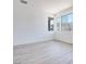 Bright living room area with large windows and modern wood floors at 9265 Frazer St, Las Vegas, NV 89166