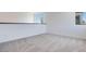 Upstairs loft area with new carpet, white walls, and modern trim at 9265 Frazer St, Las Vegas, NV 89166