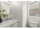 Clean bathroom with white sink, white walls, and a toilet at 9613 Eland Ct, Las Vegas, NV 89149
