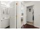 Bright bathroom features a white vanity and a large mirror at 9613 Eland Ct, Las Vegas, NV 89149