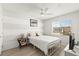 Bright bedroom with a horizontal-striped wall and natural light from the window at 9613 Eland Ct, Las Vegas, NV 89149