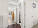 Bright hallway leading to a well-lit bedroom and an en suite bathroom at 9613 Eland Ct, Las Vegas, NV 89149