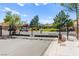 Gated community entrance with meticulous landscaping providing a secure and welcoming entry at 9613 Eland Ct, Las Vegas, NV 89149