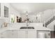 Kitchen featuring white countertops and cabinets with an open concept view at 9613 Eland Ct, Las Vegas, NV 89149