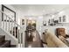 Inviting living space with wood floors, modern white cabinets, and a sliding glass door at 9613 Eland Ct, Las Vegas, NV 89149
