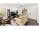 Cozy living room featuring dark hardwood floors, neutral walls, and a ceiling fan at 9613 Eland Ct, Las Vegas, NV 89149