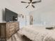Serene bedroom with ample storage, decorative furnishings, and luxury vinyl plank flooring at 9718 Camino Capistrano Ln, Las Vegas, NV 89147