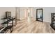 Hallway with light-colored wood floors plus a bonus room, with view to the staircase and downstairs at 9718 Camino Capistrano Ln, Las Vegas, NV 89147