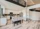 Bright kitchen features white cabinets, granite countertops, stainless steel appliances, and a large island with seating at 9718 Camino Capistrano Ln, Las Vegas, NV 89147