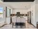 Stylish kitchen with white cabinets, granite countertops, stainless steel appliances, and a central island with bar stool seating at 9718 Camino Capistrano Ln, Las Vegas, NV 89147