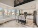 Modern kitchen with granite countertops, stainless steel appliances, and a breakfast bar at 9718 Camino Capistrano Ln, Las Vegas, NV 89147