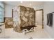 Bathroom features dual sinks, stone accents and a walk-in shower at 9718 Camino Capistrano Ln, Las Vegas, NV 89147