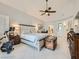 Comfortable main bedroom features high ceilings, plantation shutters, and classic furnishings at 9718 Camino Capistrano Ln, Las Vegas, NV 89147