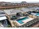 Aerial view of the backyard pool with desert landscaping and modern home at 104 Tre Pietre St, Henderson, NV 89011