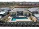 Aerial view of backyard pool with desert landscaping and modern home at 104 Tre Pietre St, Henderson, NV 89011