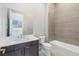 Modern bathroom features a large vanity, sleek fixtures, and combined shower and tub at 104 Tre Pietre St, Henderson, NV 89011