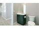Modern powder room featuring a contemporary vanity, fixtures and finishes at 104 Tre Pietre St, Henderson, NV 89011