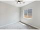 Neutral bedroom featuring gray carpet, a ceiling fan and a single window allowing natural light at 104 Tre Pietre St, Henderson, NV 89011