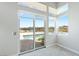 Bedroom featuring access to the backyard pool area and featuring three large windows at 104 Tre Pietre St, Henderson, NV 89011