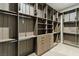 Walk-in closet with shelving and drawers and hanging racks at 104 Tre Pietre St, Henderson, NV 89011