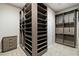 Walk-in closet with shelving and drawers and hanging racks with carpet floors at 104 Tre Pietre St, Henderson, NV 89011