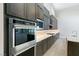Modern kitchen featuring stainless steel appliances, custom cabinets, and an open layout at 104 Tre Pietre St, Henderson, NV 89011