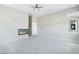 Living room features contemporary fireplace, neutral colors and ceiling fan at 104 Tre Pietre St, Henderson, NV 89011
