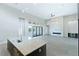 Bright, open living room with high ceilings, stone fireplace and sliding doors to outdoor space at 104 Tre Pietre St, Henderson, NV 89011