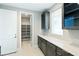 Walk-in pantry featuring custom shelving and ample storage space adjacent to gourmet kitchen at 104 Tre Pietre St, Henderson, NV 89011