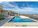 Backyard showing a modern pool with an automatic pool cover and views of mountains and neighborhood at 104 Tre Pietre St, Henderson, NV 89011