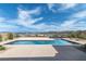 Backyard showcasing a sparkling rectangular pool and a beautiful view of the lake and mountains at 104 Tre Pietre St, Henderson, NV 89011