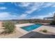 Inviting backyard pool and patio with a view of mountains and lake at 104 Tre Pietre St, Henderson, NV 89011