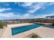 Inviting backyard pool and patio with a view of mountains and lake at 104 Tre Pietre St, Henderson, NV 89011