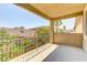 Relax on the balcony and enjoy the view overlooking a residential neighborhood and lush trees at 11478 Bargetto Ct, Las Vegas, NV 89141