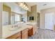 Bathroom featuring double sinks, framed mirrors and updated fixtures at 11478 Bargetto Ct, Las Vegas, NV 89141