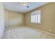 Bedroom featuring neutral paint, plush carpet and a large window with blinds at 11478 Bargetto Ct, Las Vegas, NV 89141