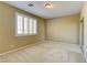 Bedroom featuring neutral paint, plush carpet and a window with plantation shutters at 11478 Bargetto Ct, Las Vegas, NV 89141