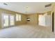 A spacious bonus room features a fireplace, french doors and neutral carpet at 11478 Bargetto Ct, Las Vegas, NV 89141