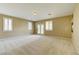 A large bonus room featuring recessed lighting, bright windows, and plush carpeting at 11478 Bargetto Ct, Las Vegas, NV 89141