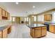Spacious kitchen with an island, wood cabinets, and stainless appliances at 11478 Bargetto Ct, Las Vegas, NV 89141