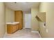 A practical laundry room with a utility sink, storage cabinet, and washer/dryer hookups at 11478 Bargetto Ct, Las Vegas, NV 89141