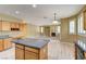 Open concept living area with fireplace, wood-look flooring, and lots of natural light at 11478 Bargetto Ct, Las Vegas, NV 89141