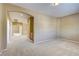 Spacious living room with an archway and a beige carpet at 11478 Bargetto Ct, Las Vegas, NV 89141