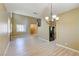 Open floor plan with a view of the kitchen, fireplace, and stairs at 11478 Bargetto Ct, Las Vegas, NV 89141