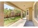 Covered patio with an outdoor ceiling fan and view of landscaped yard at 11478 Bargetto Ct, Las Vegas, NV 89141